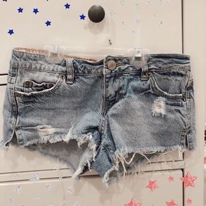 Rip curl: distressed denim shorts